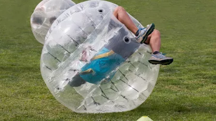 man rolling in a bubble ball