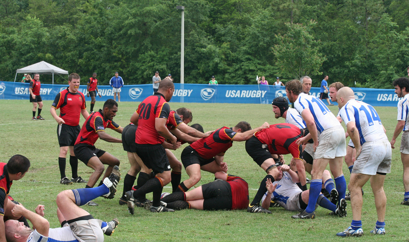 Men competing in rugby match.